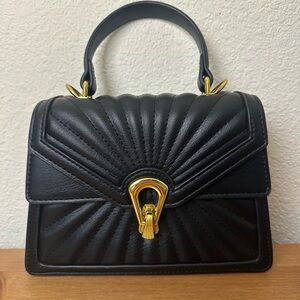 Elegant Black Handbag with Gold Accents